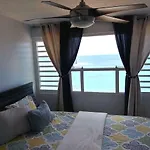 Breezy Beachfront Property With View Of Paradise